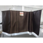PhotonSafe laser welding safety curtain in industrial setting